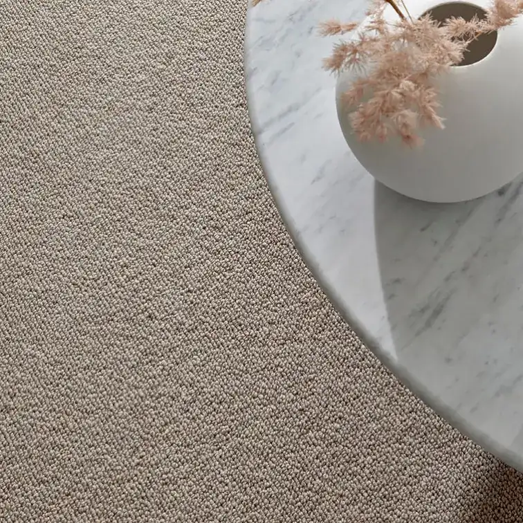 Loop pile carpet meeting marble in a Gold Coast home