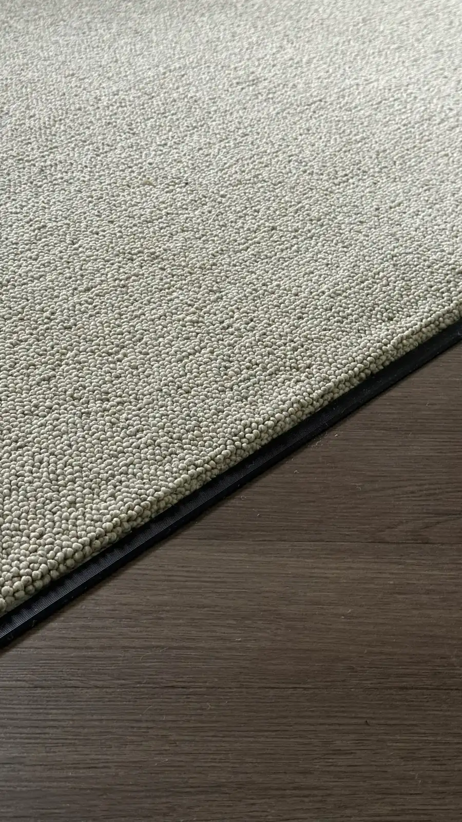 Loop pile carpet meeting timber flooring in a Gold Coast home. Bell Carpets installation